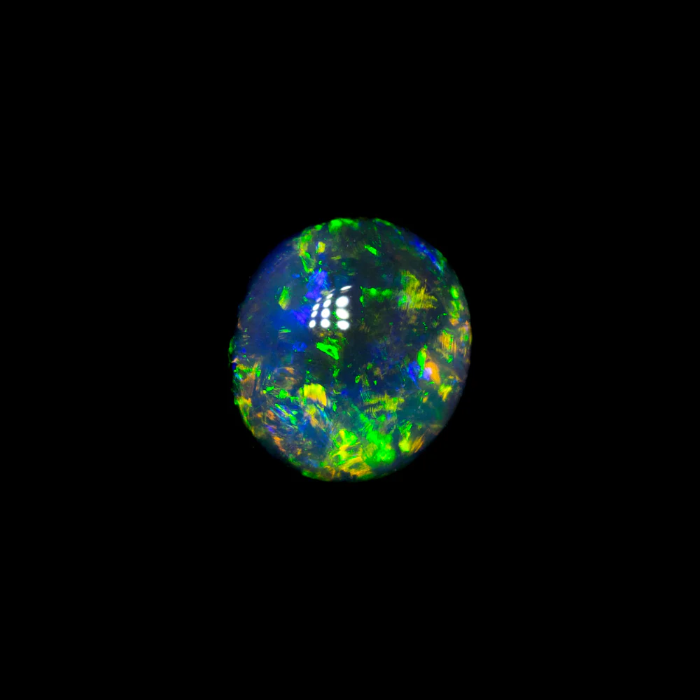 0.47 ct black opal 5.3x4.8x2.9mm