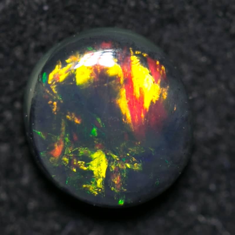 0.47 ct black opal 5.5x5x2mm