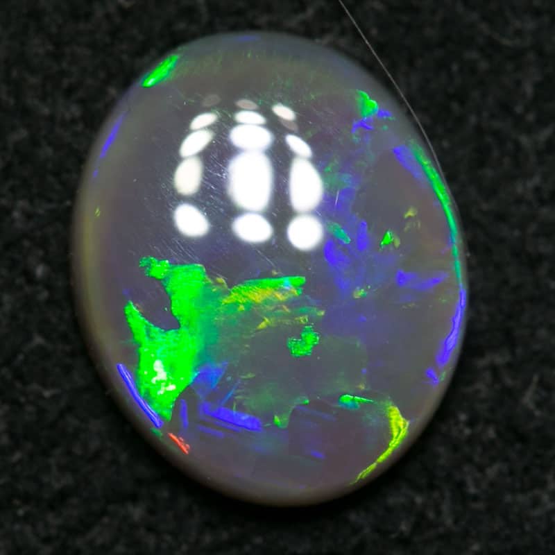 0.58 ct dark opal 6.5x5.5x2mm