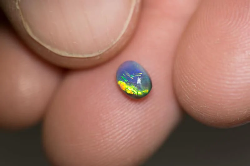 0.61 ct black opal 6x4x3mm