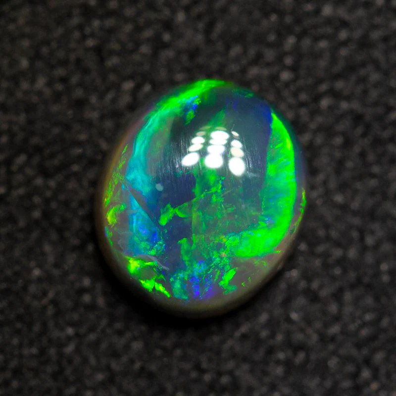 0.62 ct black opal 6x5.2x2.8mm