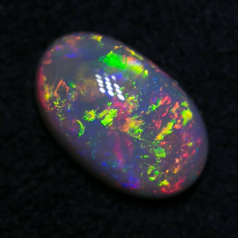 0.63 ct dark opal 7x4x2.5mm