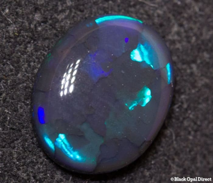0.64 ct black opal 7x6x2mm