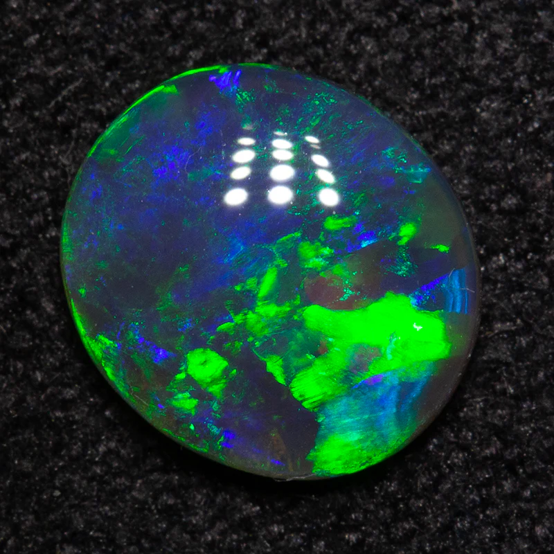 0.65 ct black crystal opal 7.3x6.5x2.5mm