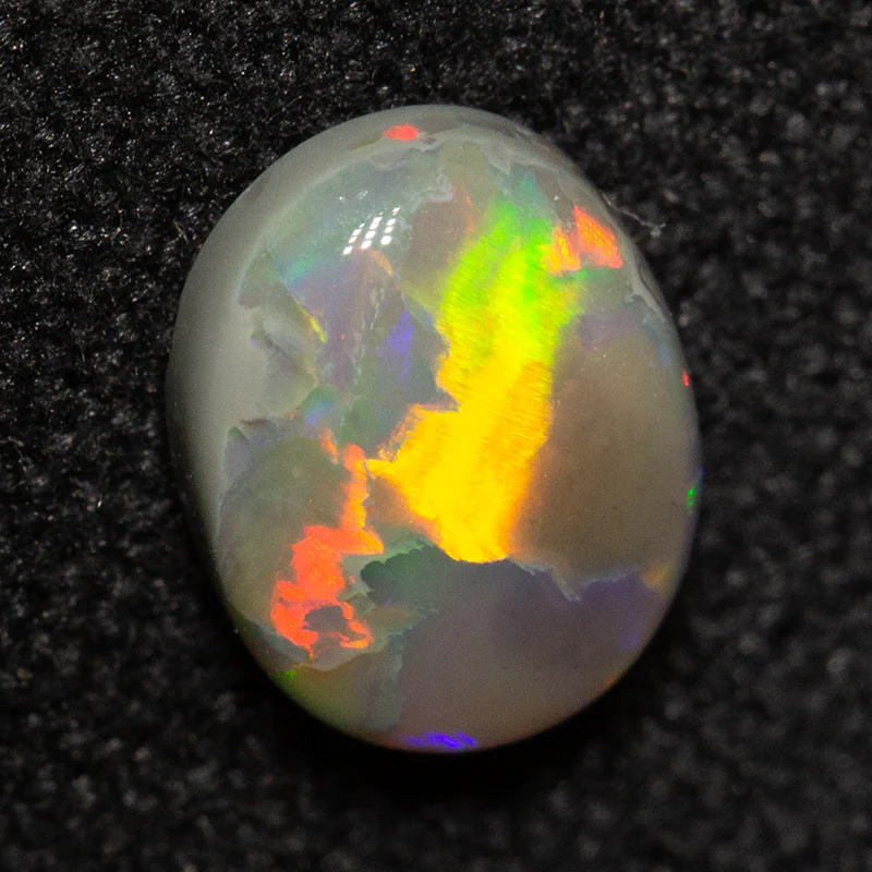 0.65 ct dark opal 6.9x5.3x2.5mm