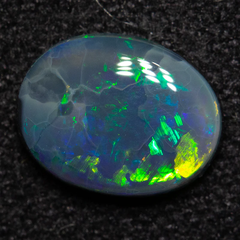 0.66 ct black opal 7.5x5.8x2.2mm
