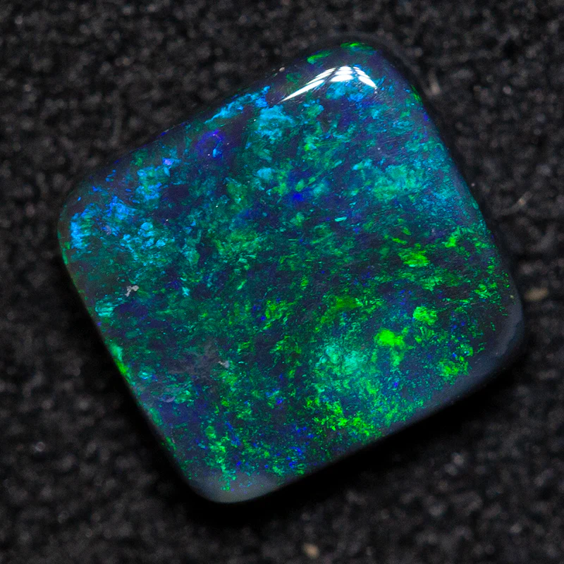 0.73 ct black opal 6.4x6.1x2.1mm