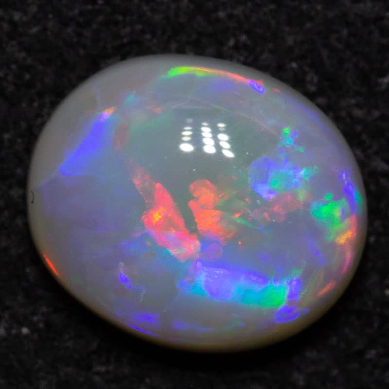 0.74 ct dark opal 7x6x2.7mm
