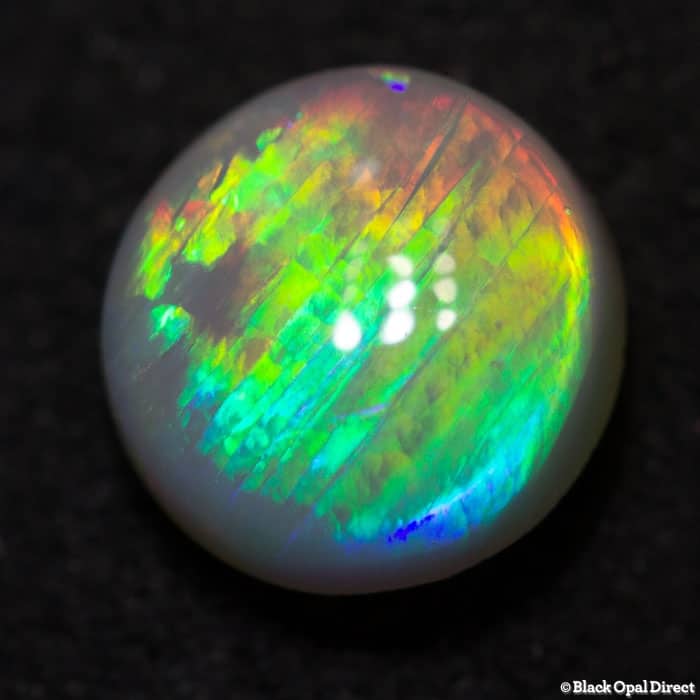 0.75 ct semi black opal 6mm round x3mm