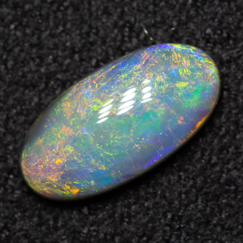 0.76 ct dark opal 9.1x4.7x2.7mm