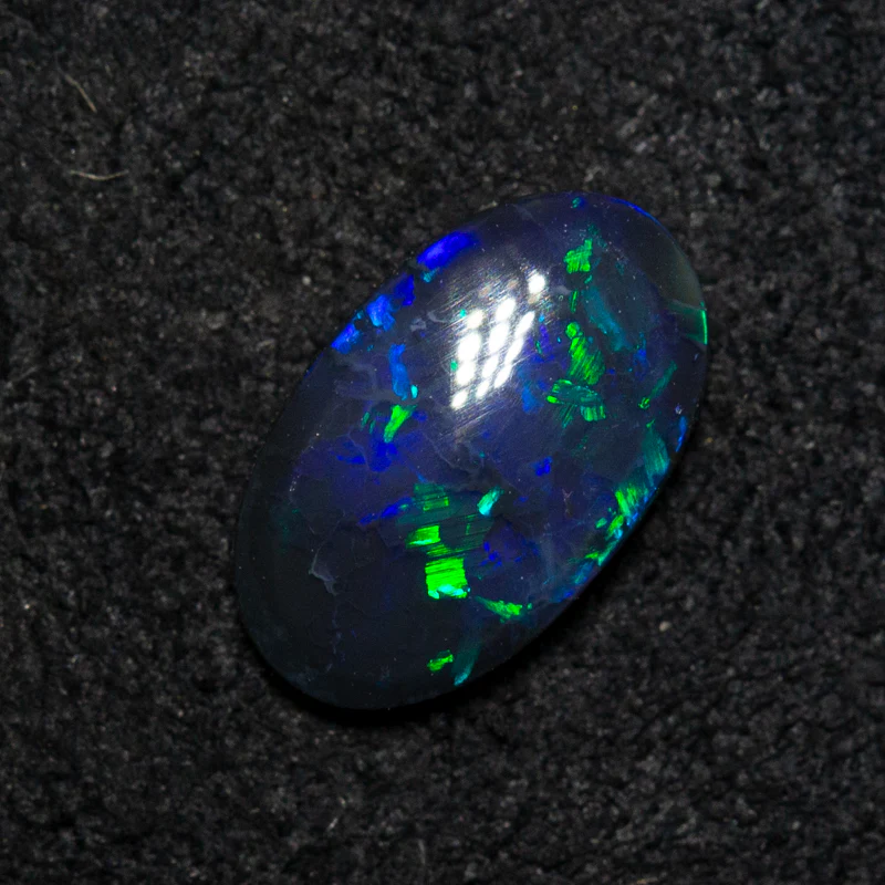 0.82 ct black opal 9x5.4x2.4mm