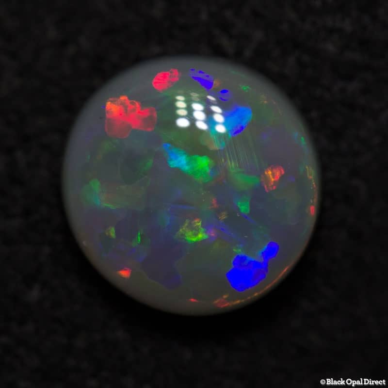 0.85 ct semi black opal 7mm round x 3mm