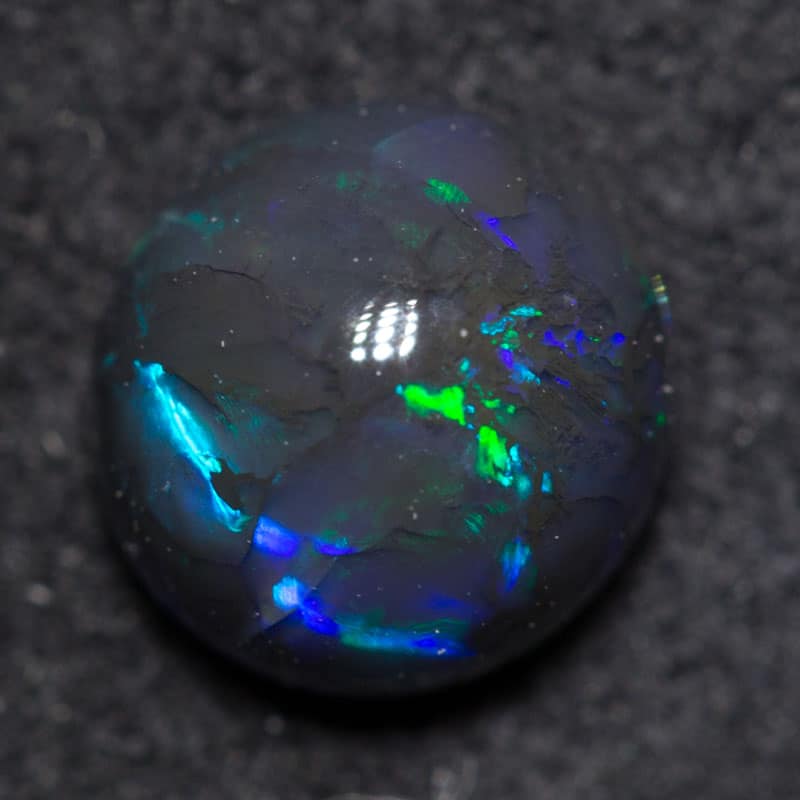 0.88 ct black opal 6x6.3x4mm