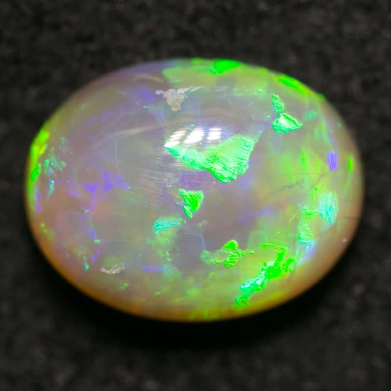 0.88 ct dark opal 7x5x4mm
