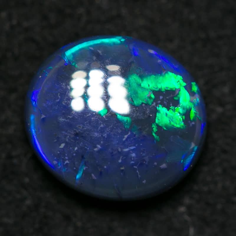 0.93 ct black opal 7x6x3mm