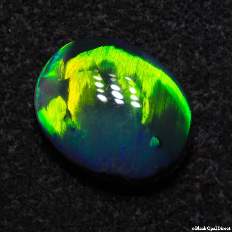 0.93 ct gem black opal with rolling flash pattern 7.9x6x3mm