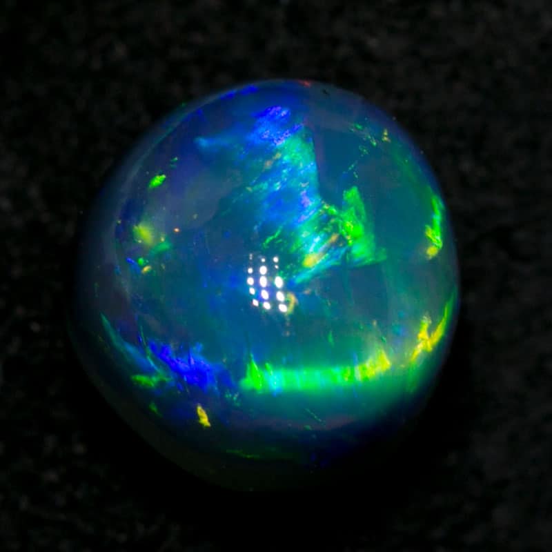 0.97 ct gem black opal 5.5 round x4.5mm thick