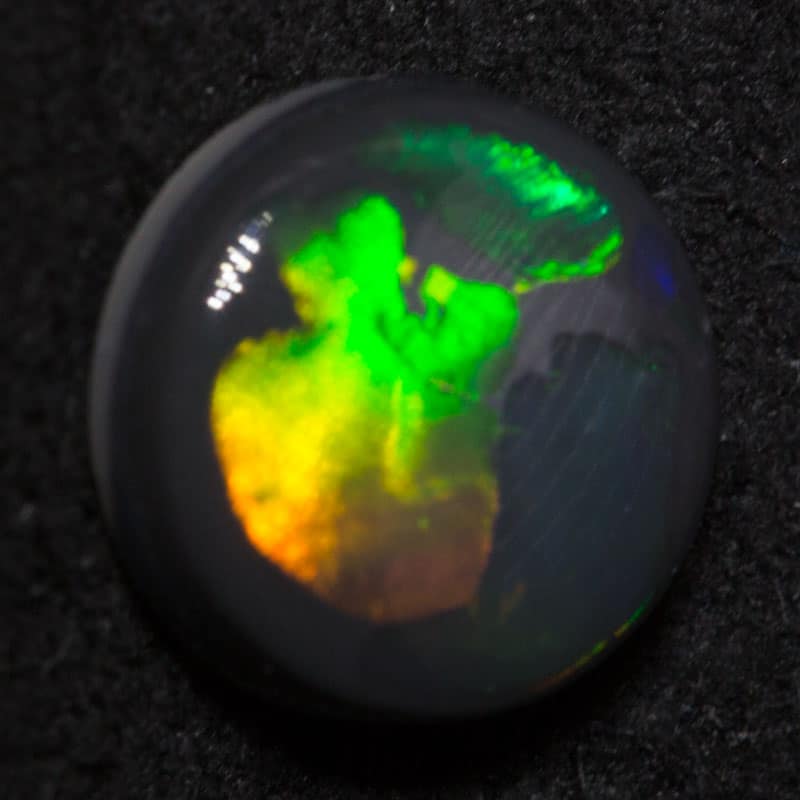1.00ct black opal 7.6x7.4x2.6mm