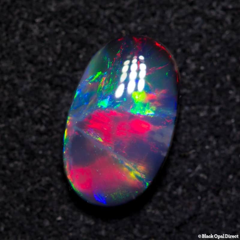 1.04 ct gem black opal with Pidgeon blood red 9x5x2.8mm