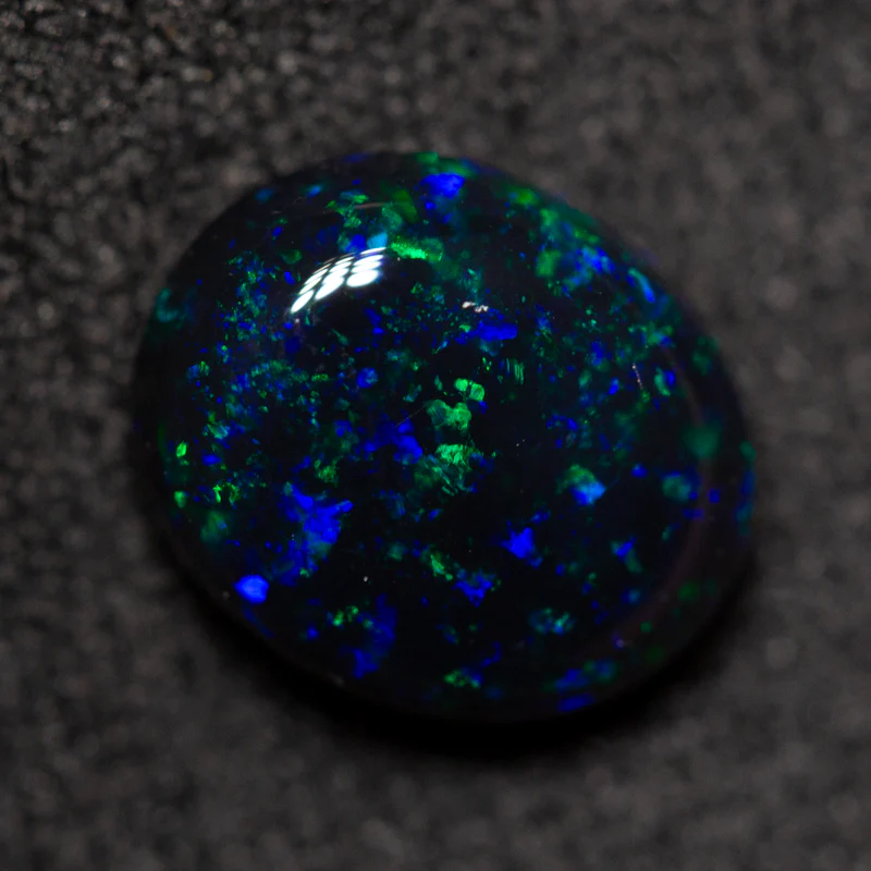 1.64 ct black opal 8.8x7.3x4.1mm