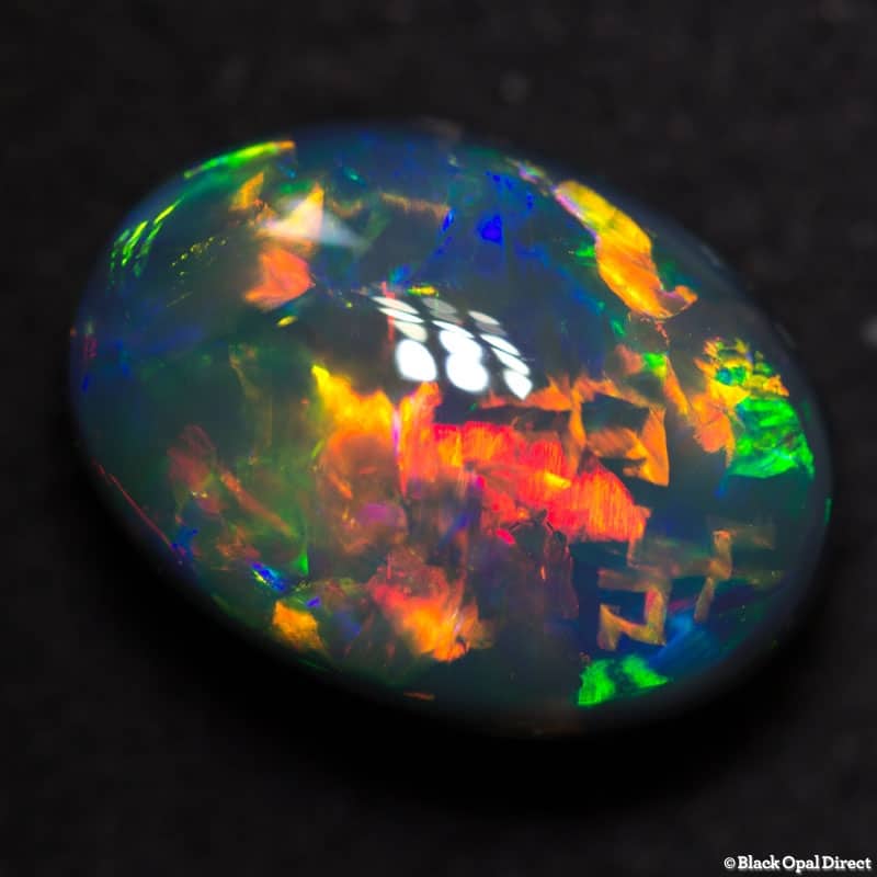 5.17 ct gem black collectors opal with Chinese Writing 13x9.5x6.5mm