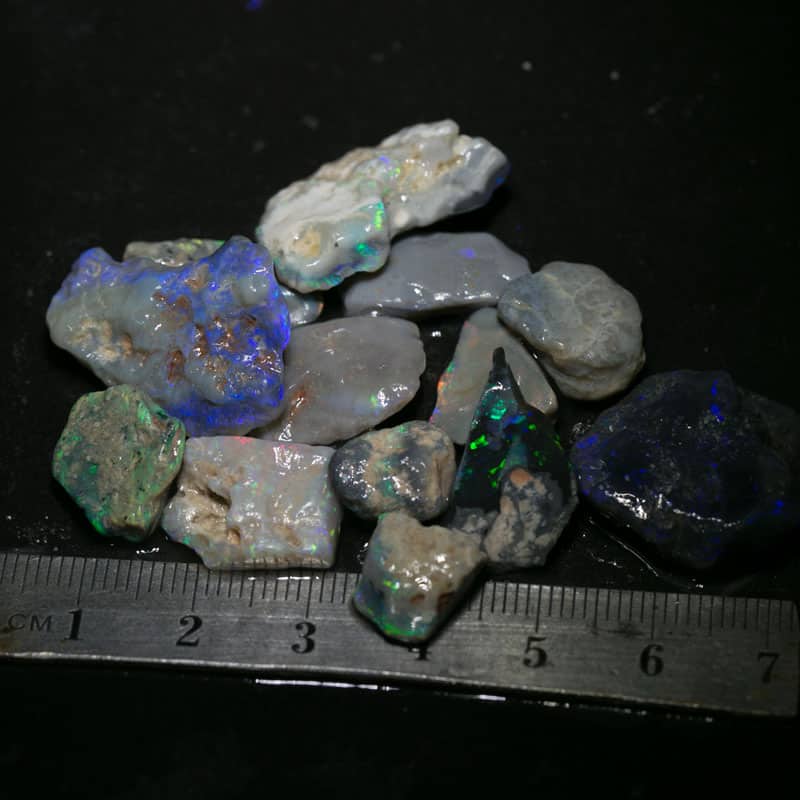 82 ct 13pc rough opal parcel for intermediate cutters